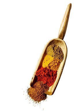 Scoop of colourful dry spices