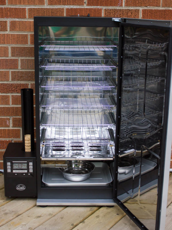 Inside of a new food smoker with racks